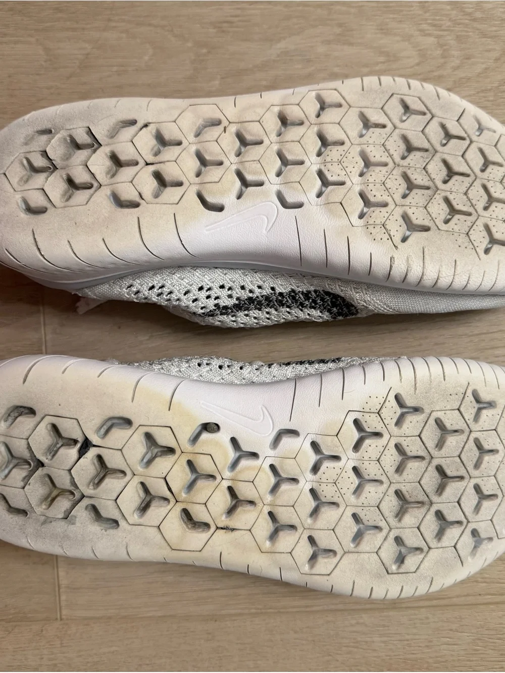 Nike Women’s White and Black Flyknit Sneakers